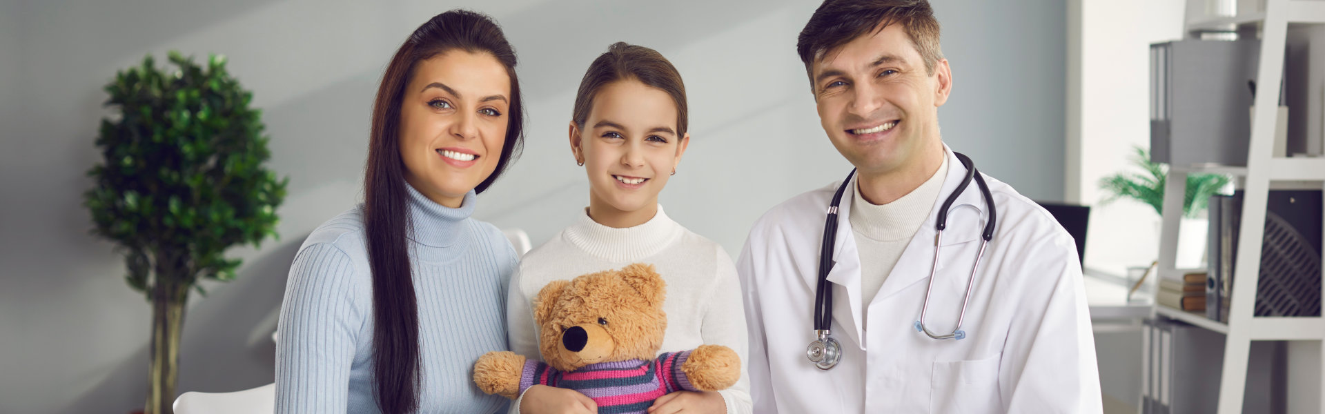 mother and daughter together with the pediatrician