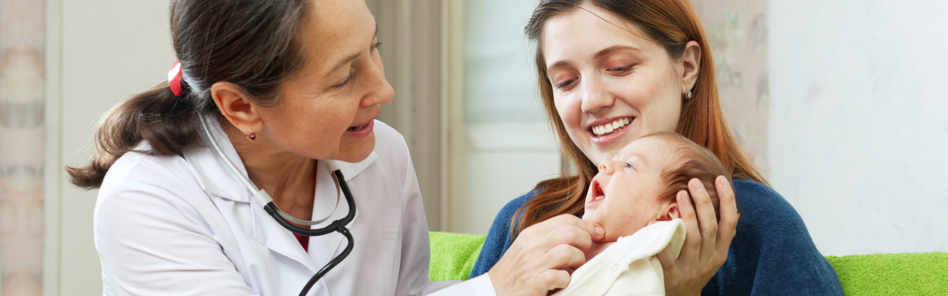 pediatrician examining new born baby in their house