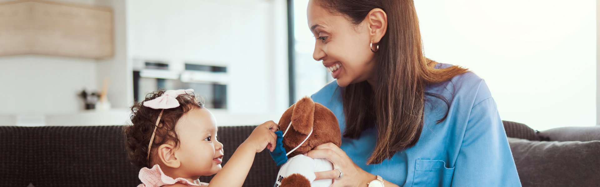 nurse and a little girl playing